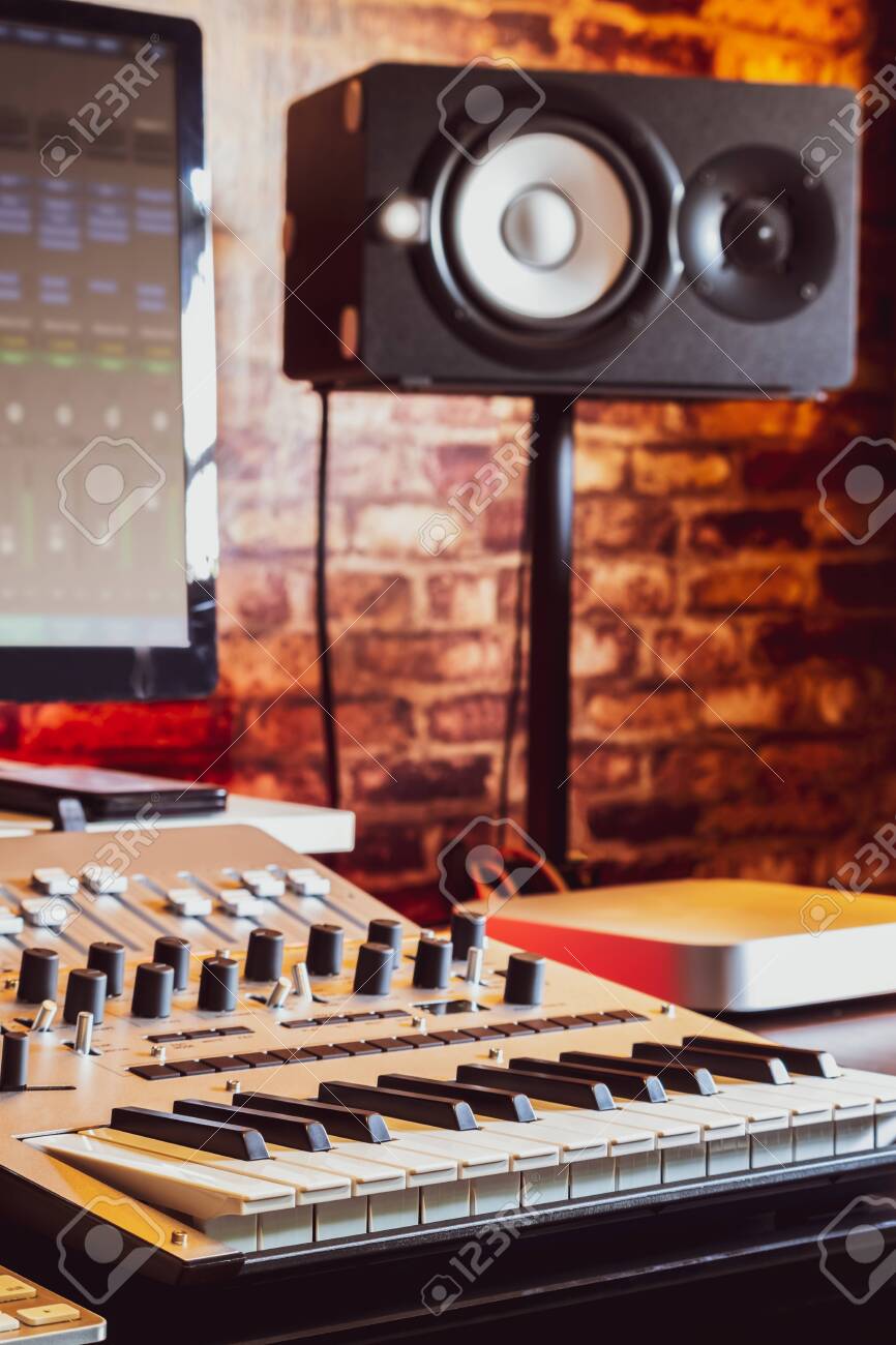 118203311-recording-studio-equipment-computer-midi-keyboard-synthesizer-loudspeakers-mixing-console